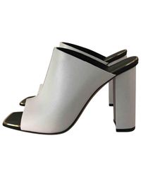 Céline Pre-owned Leather Mules in White 