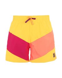 yellow nike swim trunks