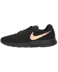 nike tanjun black metallic red bronze