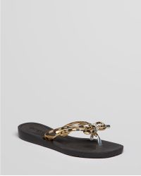 guess black flip flops with bow