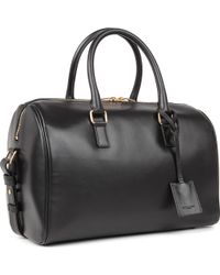 Saint Laurent Holdalls and weekend bags for Women - Up to 76% off at ...