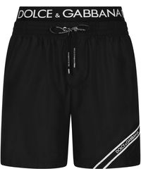 Dolce & Gabbana - Mid-length swim trunks with branded band - Lyst