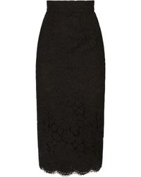 Dolce & Gabbana - Jupe mi-longue en dentelle stretch à logo - Lyst