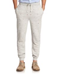 ripped jeans with black patches