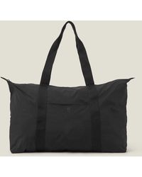 Accessorize - Women's Black Nylon Packable Travel Weekender Bag - Lyst