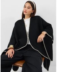 Accessorize - Whipstitch Knit Poncho - Lyst