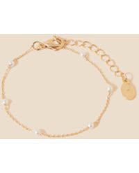 Accessorize - Women's Gold Brass Pearl Station Bracelet - Lyst