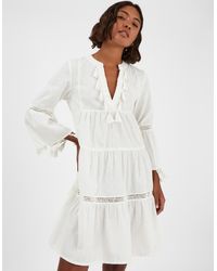 Accessorize - Flute Sleeve Tassel Tiered Mini Dress - Lyst