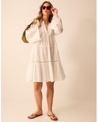 Accessorize - Flute Sleeve Tassel Tiered Mini Dress - Lyst