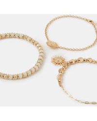 Accessorize - 3-Pack Sun Charm Beaded Anklets - Lyst