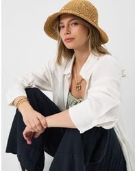Accessorize - Beaded Flower Straw Bucket Hat - Lyst