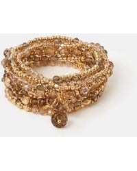 Accessorize - 8-Pack Beaded Charm Stretch Bracelets - Lyst