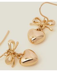 Accessorize - Women's Gold Heart Bow Drop Earrings - Lyst