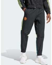 adidas - Pantaloni da allenamento Woven Manchester United FC - Lyst