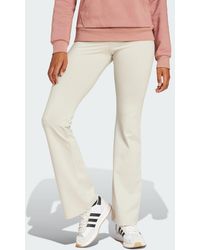 adidas - Essentials Small Logo Flared Leggings - Lyst