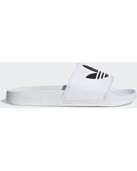 Chanclas de dedo y de pala adidas de mujer: hasta el 40 % de descuento |  Lyst