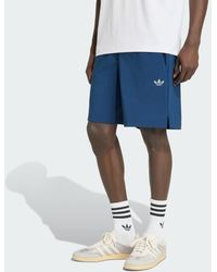 adidas - Pantalón Corto Poliéster Tech Trefoil Essentials - Lyst