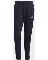 adidas - Pantaloni Essentials French Terry Tapered Cuff 3-Stripes - Lyst
