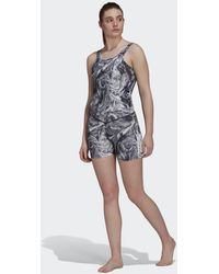 Damen Bekleidung Jumpsuits und Overalls Playsuits adidas Synthetik Hyperglam AEROREADY Training Marble-Print Onesie in Schwarz 