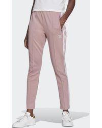 Pantalón Primeblue SST adidas de Algodón de color Rojo - Lyst