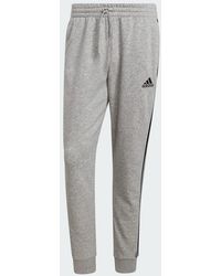 adidas - Essentials Tapered Cuff 3-Stripes Joggers - Lyst