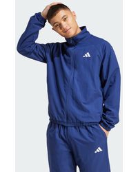 adidas - Giacca A Vento Essenziale Con Logo Piccolo - Lyst