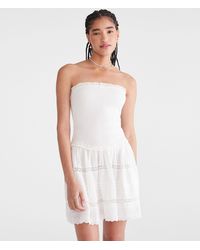 Aéropostale - Solid Strapless Smocked Lace Drop-Waist Mini Dress - Lyst