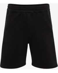Alexander McQueen Shorts con banda logata cimosata - Nero