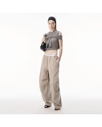 Alexander Wang - Mid-Rise Pleated Wide-Leg Pant With Logo Elastic Waist - Lyst