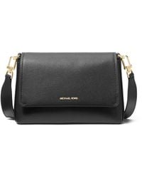 Michael Kors - SM MESSENGER BLACK - Lyst