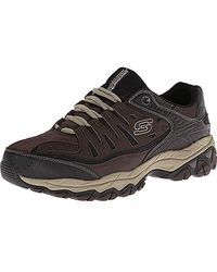 skechers lace up sneakers dorados