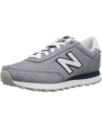 new balance 501 gray and white sneakers