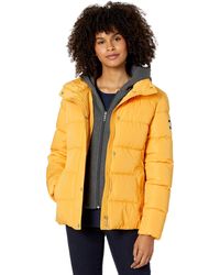 Tommy Hilfiger Padded and down jackets for Women - Up to 39% off at Lyst.com