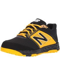 new balance black and yellow turf shoes