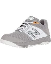 new balance black and yellow turf shoes