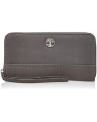 Timberland - Portafoglio da donna in pelle RFID con cerniera e cinturino da polso - Lyst