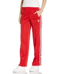 red and black adidas tracksuit womens