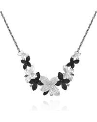 Guess - Collana con ciondolo floreale in cristallo nero argento - Lyst