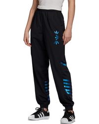 originals large logo track pants in black & team royal blue