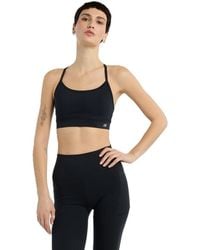 New Balance - Nb Essential Yoga Bra - Lyst