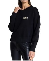 Guess - Langarm Sweatshirt mit elastischem Saum und Bündchen Rundhalsausschnitt schwarz L - Lyst