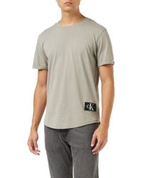 Calvin Klein - Jeans T-shirt iche Corte Uomo Badge Turn Up Sleeve Scollo Rotondo - Lyst