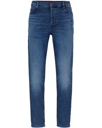 HUGO - 634 Blaue Tapered-Fit Jeans aus bequemem Stretch-Denim Blau 31/32 - Lyst