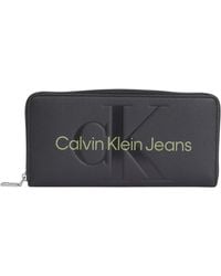 Calvin Klein - Sculpted Zip Around Mono Wallets - Lyst