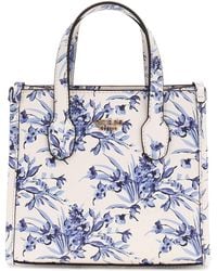 Guess - Silvana Mini Two Compartment Tote Floral Multi - Lyst