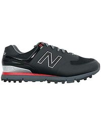 red and black new balance turfs