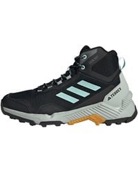 adidas - Eastrail 2.0 Mid RAIN.RDY Hiking Shoes Sneakers - Lyst