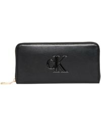 Calvin Klein - Cartera Mujer Bold Long Zip Around con logotipo - Lyst