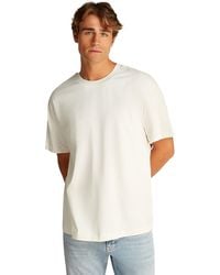 Calvin Klein - Uomo T-Shirt iche Corte Logo Tape Tee con Scollo Rotondo - Lyst