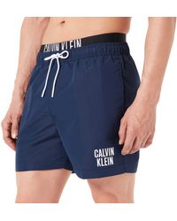 Heren Kleding voor voor Strandkleding voor Board Calvin Klein Nen Medium Drawstring-print Trunks in het Zwart voor heren en zwemshorts 